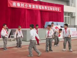 MS School students doing long jump on playground of school/xian,shaanxi,China Stock Footage