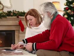 Adult couple examining financial documents Stock Footage