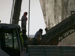 MS Workers merchandising boat unloading / Djibouti Stock Footage