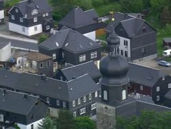 MS AERIAL DS Shot of houses and running vehicle on road way / Germany Stock Footage
