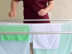 Housewife hanging up laundry Stock Footage