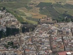 Aerial view of city with bullring and Tajo Bridge, Ronda, Andalusia, Spain Stock Footage