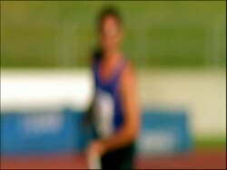 MS pole vaulter out of focus, running towards camera and into focus, Australia Stock Footage