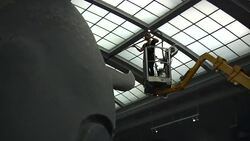 The American Museum of Natural History's famous blue whale is getting its annual dusting. A worker piloted a cherry picker and carefully vacuumed the dust from the giant replica as onlookers watched. (July 8) News Clip