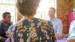 Group talking in group therapy session Stock Footage