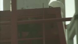 A technician checks equipment in a radar tower. Stock Footage