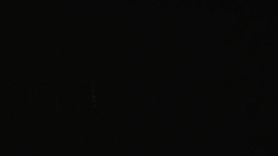 Fireworks explode and sparkle in a night sky. Stock Footage