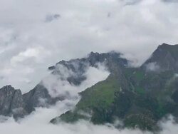 T/L clouds swirling over Chame mountains, Himalayas Stock Footage