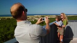 MS, Man photographing wife and son (4-5) on beach, Provincetown, Massachusetts, USA Stock Footage