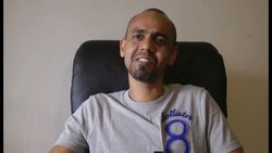 A grocery store employee said Thursday that he is thanking God and his belt buckle for saving him from a stray bullet that smashed through the market's front door. News Clip