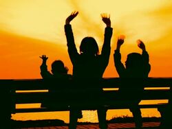 Woman with child at sunset near the sea Stock Footage