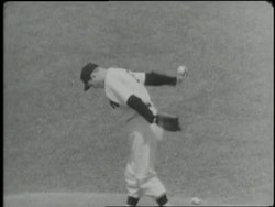 New York Yankee Joe DiMaggio bats and runs to second base. News Clip