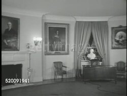 1948: WASHINGTON, D.C.: THE WHITE HOUSE: VS Diplomatic Reception Room, late President Franklin D. Roosevelt portrait painting, male in suit setting up NBC microphones on desk. Instructional Video