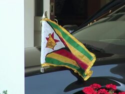 June 2009 CU Zimbabwean flag on Limousine carrying Zimbabwe's Prime Minister, Morgan Tsvangirai, to the White House/ Washington DC, USA/ AUDIO Stock Footage