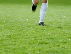 MS PAN TU R/F professional soccer team celebrating together on field in rain storm after winning match Stock Footage