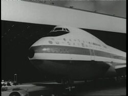 Passengers board a Boeing 747. News Clip
