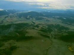 Early morning high altitude panning wide shot of the Bridger Valley near Bozeman, MT Stock Footage