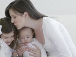 Caucasian mother with baby and little girl Stock Footage