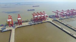 Aerial view of commercial dock with cargo containers in shanghai. Stock Footage