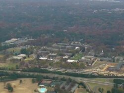 WS AERIAL View of Meridith College, Raleigh with wooded city / North Carolina, United States Stock Footage