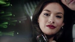 Hollywood starlet stares at camera, turns to gaze out at paparazzi at awards show Stock Footage