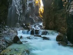 MS T/L Shot of river passing through deep mountain gorge "Partnachklamm" / Garmisch Partenkirchen, Bavaria, Germany Stock Footage