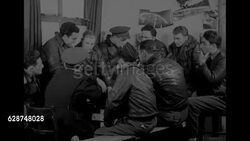 US flight crews debrief after completing bombing mission over Germany during World War II News Clip