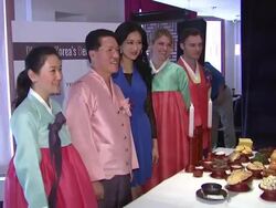 Woon Chun Chung (2nd from L), Kelly Choi (in blue) and guests  Stock Footage