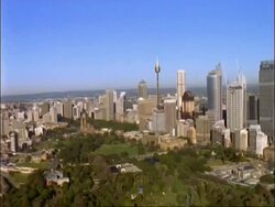 Aerial view of Sydney skyline, pan left over harbour, Sydney, Australia Stock Footage