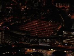 Aerial view past Waterloo Station at night / London, England Stock Footage