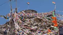 Buddhist Tibetan flags at the Khardung La Pass Stock Footage