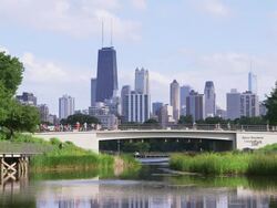 WS Chicago skyline with park and pond Stock Footage