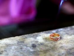 Goldsmith Jeweler use gasoline burner melting and decorating gold Stock Footage