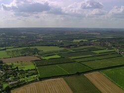 Aerial wide shot over fruit farms near Canterbury / Kent, England Stock Footage