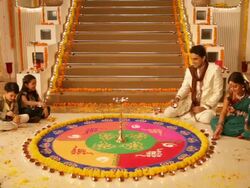 Family preparing rangoli in diwali festival Stock Footage
