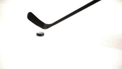 Ice hockey player playing a puck. Stock Footage