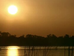 WS Sunset over water and mangroves / Kakadu National Park , Australia     Stock Footage