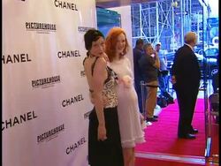 2007 LA VIE EN ROSE PREMIERE: PARIS THEATER, NEW YORK CITY: Filmmaker Sarah Sophie Flicker (L) & FEMALE friend, pregnant, standing together on red carpet at the Paris Theatre in NYC posing for photographs for press. Stock Footage