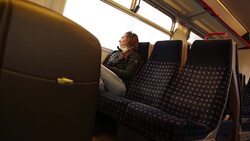 Close up Solo Woman Traveler Journeys on Train Stock Footage