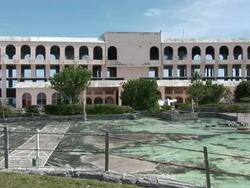 WS Hotel in resort setting is demolished in controlled implosion using explosives / St. George's , Bermuda Stock Footage