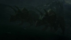 Fiery debris rains down on Triceratops in a computer generated animation. Stock Footage