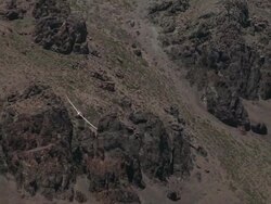 2010 AERIAL Glider flying over barren, rocky Andes mountains / Santiago de Chile, Gran Santiago, Chile Stock Footage