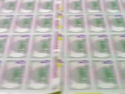ECU, Sheets of American five dollar bills moving fast on conveyor, Washington DC, USA Stock Footage