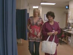 Nurse giving instructions to a pregnant woman Stock Footage
