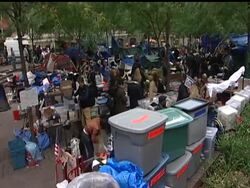 Crackdowns against the Occupy Wall Street encampments reached the movement's epicenter on Tuesday, when police rousted protesters from New York's Zuccotti park.   Later, a judge ruled that protesters' free speech rights do not extend to camping in the park. News Clip