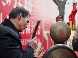 MS CU Chinese artists of folk puppet art troupe playing accompaniment with traditional music instrument at temple fair to celebrate Chinese spring festival AUDIO / xi'an, shaanxi, china Stock Footage