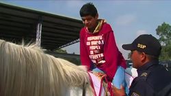 Police horses help sick Mexican children News Clip