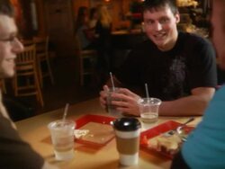 Guys talking at coffee house Stock Footage