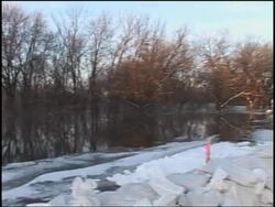 Chilly temperatures slow rise of swollen Red River Instructional Video