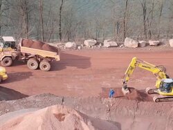 WS Crane collecting mud from  quarry / Taben-Rodt, Hesse, Germany Stock Footage
